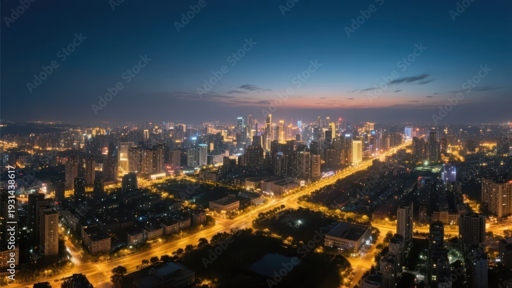Obraz premium An aerial view of an urban dusk nightscape, where warm yellow street lamps interweave with a cool blue night sky, presenting the quiet beauty of a prosperous city, making it a material image suitable 