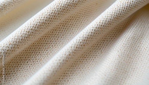 A close up of a textured fabric, which appears to be lace or embroidered material with a fine pattern, possibly a wall hanging or window treatment.