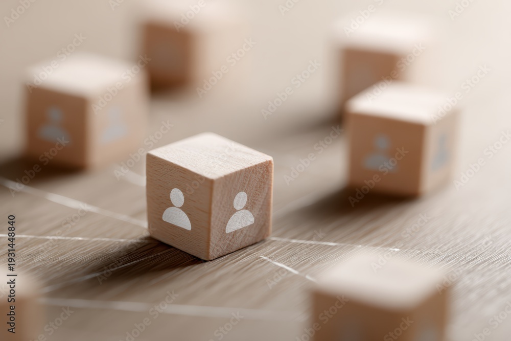 Fototapeta premium Wooden blocks showing network connection between leader and team icons, collaboration concept