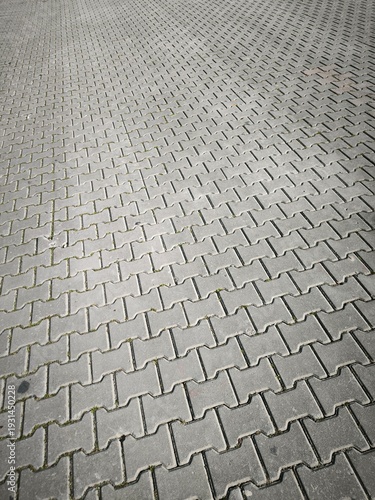 Detailed view of interlocking brick pavement in Kulturpark, Izmir. Repetitive stone surface pattern ideal for construction, architecture and texture background use.