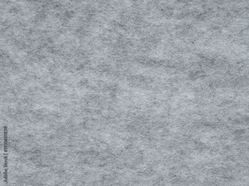 Fototapeta premium Soft grey felt. Surface of felted fabric texture abstract background in gray color. Pattern for text, lettering, patch work or other art work. Full frame backdrop wallpaper. High resolution photo.