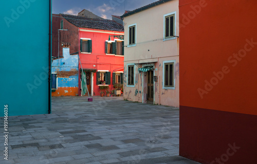 A neighborhood street with painted houses at Burano island, Venice