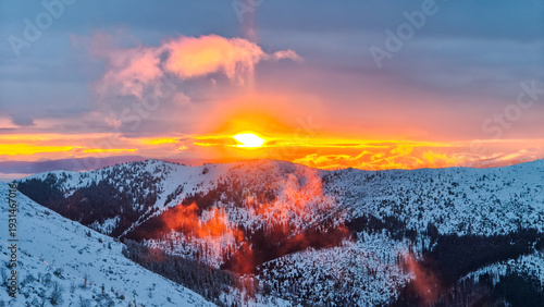 Breathtaking golden hour sunset illuminating majestic snow-capped mountains in Chopk mountains