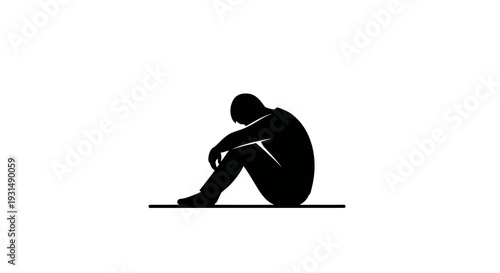 Silhouette of a person sitting alone in contemplation
