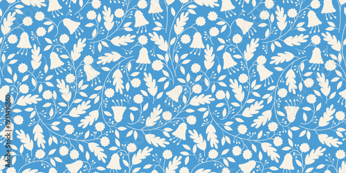 Seamless blue and white floral pattern with dense flowers, leaves and botanical silhouettes. Elegant repeating background for fabric, wallpaper, wrapping paper, stationery and surface prints.