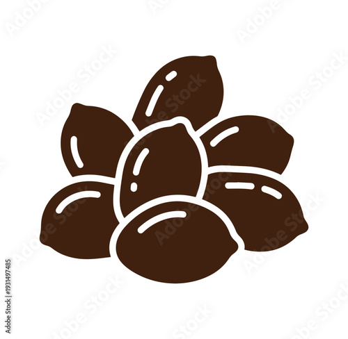 brown almond nuts in a pile on white background