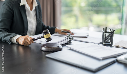 Lawyer businessman working with lawbook in office or courtroom Legal counsel with gavel and legal law. justice and lawyer concept Judge gavel hammer on Lawyer desk