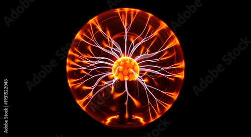 A plasma globe with vibrant orange and yellow electric discharges and a central glowing sphere, emitting radiant energy from within, against a dark background, viewed from a close-up perspective