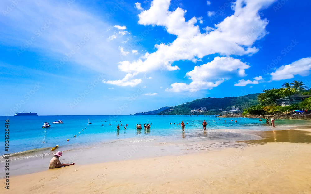 Fototapeta premium Tropical Patong Kamala Beach Phuket Thailand tourists people parasol palm.