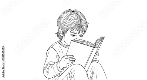 Little boy reading book while sitting at home