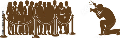 Professional brown silhouette of a photographer kneeling to take a group photo of celebrities behind a velvet rope at red carpet event.