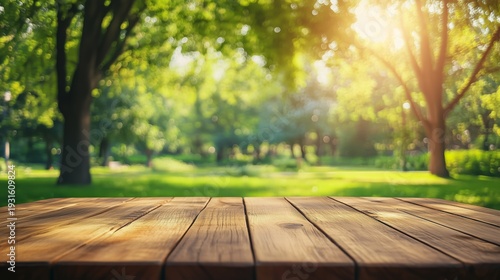 Wooden Table in a Park With Green Trees and Sunlight Shining Down During the ...