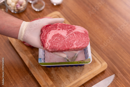 The beef is being unpacked from the package.