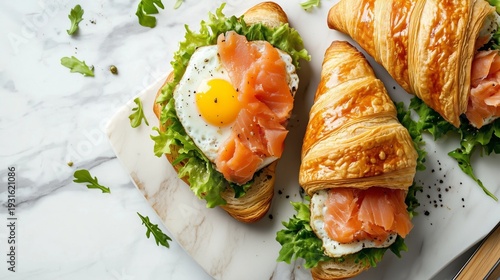 Crispy Croissant With Smoked Salmon and Egg Served on a Marble Platter With S...