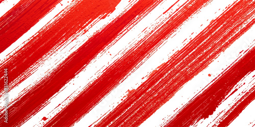 Red and white striped background featuring a seamless diagonal line pattern with a vintage grunge texture on a decorative cotton fabric material or wallpaper design
