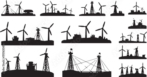 Silhouettes of wind turbines and power transmission towers