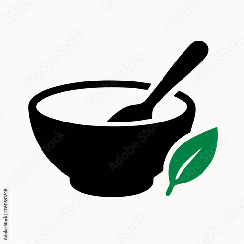 Simple mortar and pestle with green leaf for herbal medicine
