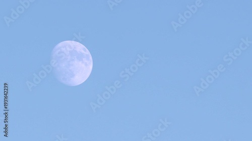 Moon in the sky shining during daylight.