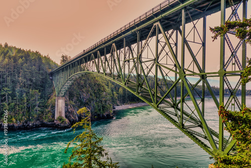 Iconic Deception Pass Bridge over turbulent turquoise waters.