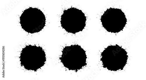 abstract black ink splatters and paint blots on a white background ideal for grunge texture and graphic design elements