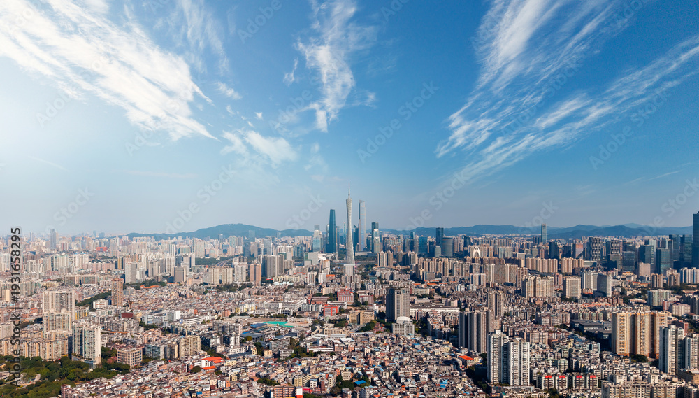 Obraz premium Panoramic skyline of Guangzhou with skyscrapers and blue sky, aerial photo of China for travel