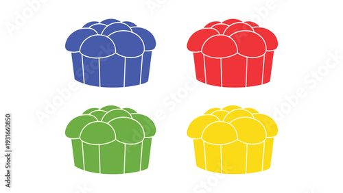 Four colorful cupcakes with different toppings arranged in a square