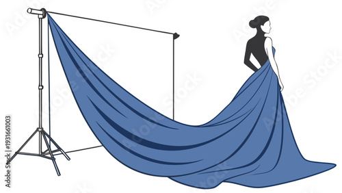 Woman in elegant dress with flowing fabric on a photoshoot set.