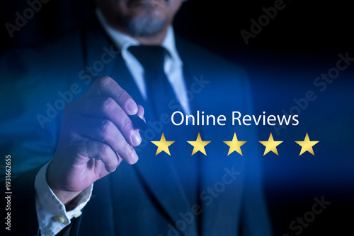 Online ratings and excellent service. Businessman using smartphone to give five-star positive review. Customer review satisfaction feedback survey concept.
