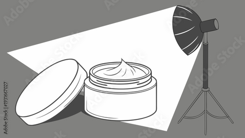 Product photography setup with cosmetic cream jar and studio light.
