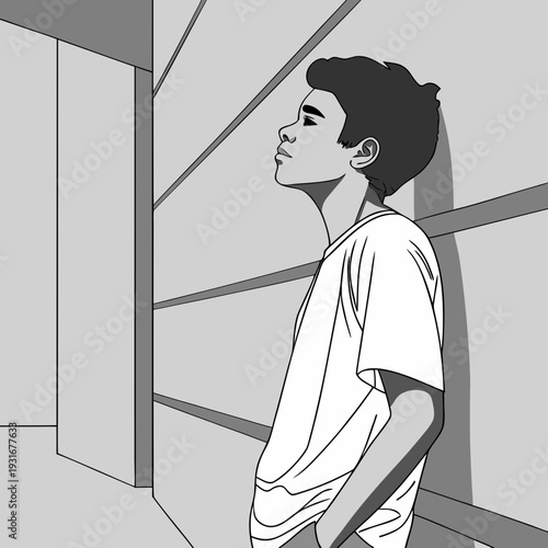Young man looking up with thoughtful expression in a minimalist setting.