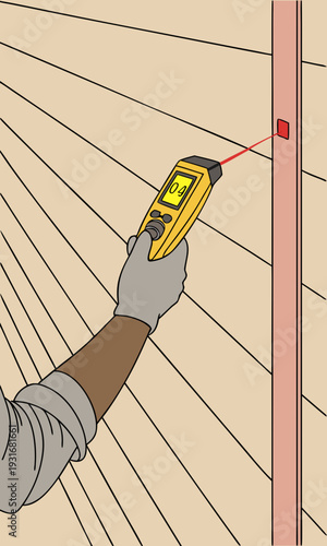 Hand holding a stud finder with a laser beam pointing at a wall.