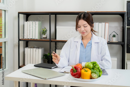 Portrait asian woman nutritionist working in medical clinic office, doctor specialist diagnosis planning nutrition, weight control for patient wellness, consultation for weightloss with meal plan.