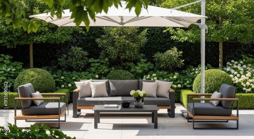Outdoor patio furniture set with parasol in a tranquil garden setting
