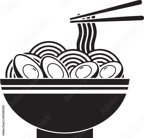 A steaming bowl of noodles being picked up with chopsticks from a table indoors.