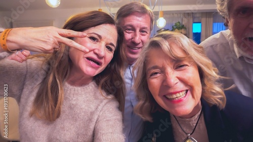 Senior friends making selfie grimace together at home