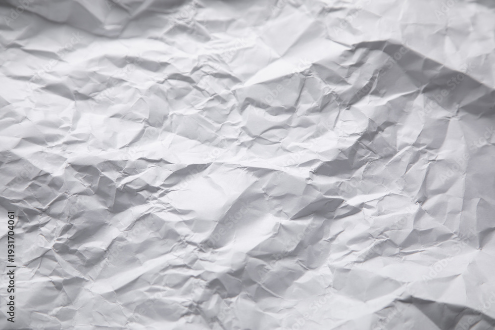 Obraz premium Crumpled paper background. White paper texture