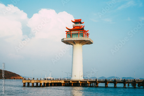 Lighthouse on coastal area and blue sky of Koh Si Chang, Chonburi province, Thailand