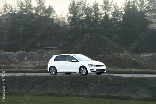 Photos Low-cost hatchback vehicle under sunlight