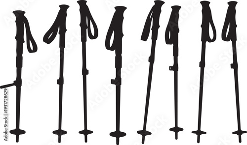 Black trekking poles arranged in a row on white