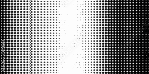 Abstract halftone pattern transitioning from black to white with dots