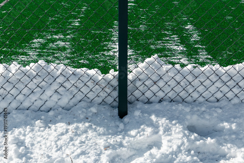 A football field cleared of snow in winter