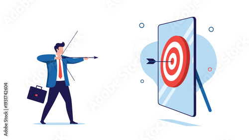 Ambitious businessman using a bow and arrow to hit a bullseye target shown on a large tablet screen for digital accuracy.