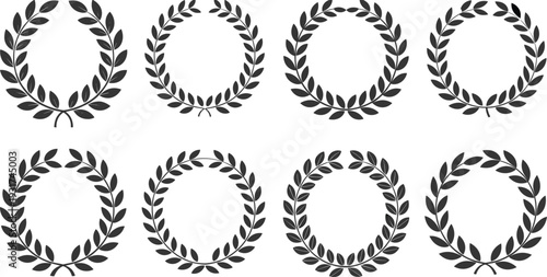 Black and white vector set of laurel wreath silhouettes in circular frame designs for award emblem logo decoration and vintage branding use