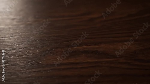 Close-up of richly textured, dark brown wood surface with visible grain patterns
