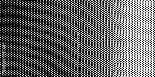 A halftone pattern transitioning from dense black to white space