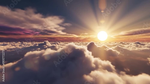 Beautiful golden sun setting above f clouds in a vibrant sky