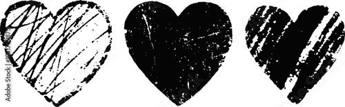 Three hand drawn black grunge hearts with textured distressed brush strokes isolated on white background