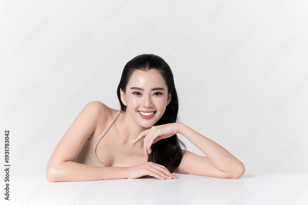 Naklejka premium Beautiful portrait of young asian woman with healthy facial and body skin, healthy hair, care teeth and glowing natural makeup for advertise skincare product, wellness, self care and cosmetic concept.
