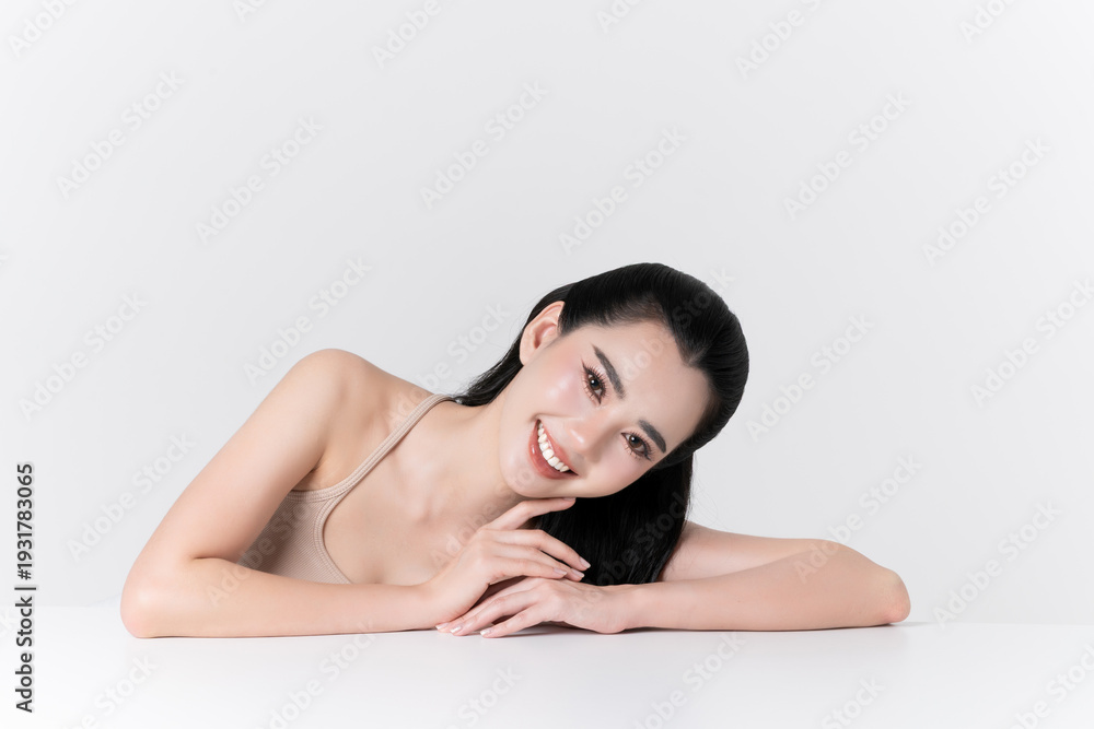 Fototapeta premium Beautiful portrait of young asian woman with healthy facial and body skin, healthy hair, care teeth and glowing natural makeup for advertise skincare product, wellness, self care and cosmetics concept