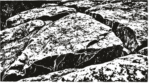 Large cracked stone slab in rough rocky terrain with textured surface and fractures